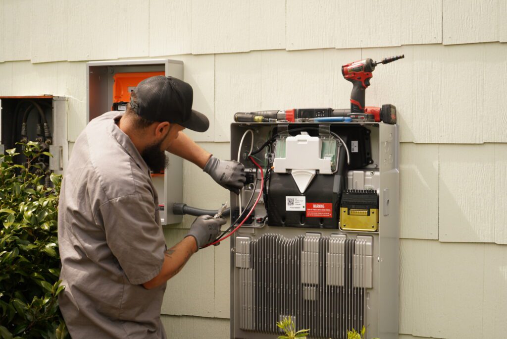 Judson Clements repairing equipment