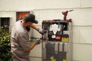 Free On-Site Electrical Estimates in Hampton Roads: Planning Your Project the Right Way 16 Judson Clements repairing equipment